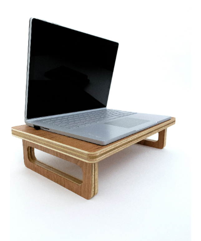 CNC machine cutting out the shape of a wooden mouse pad from a flat piece of wood, following the design file.
